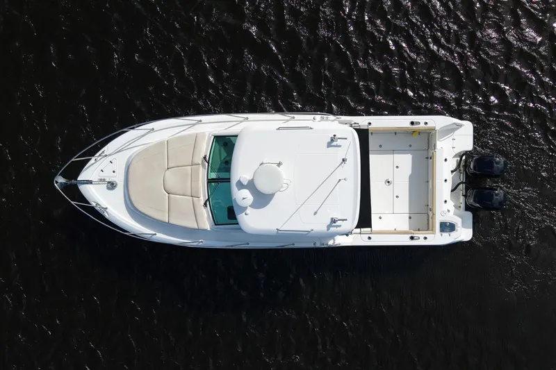 Slide: The Image of Overhead view of 2015 Boston Whaler 315 Conquest boat on dark water. - 17