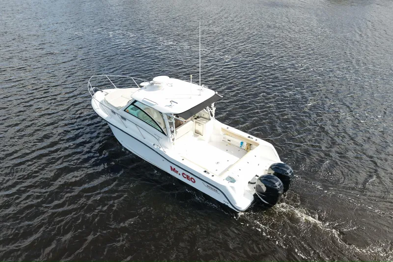 Slide: The Image of 2015 Boston Whaler 315 Conquest boat on open water, aerial view. - 38