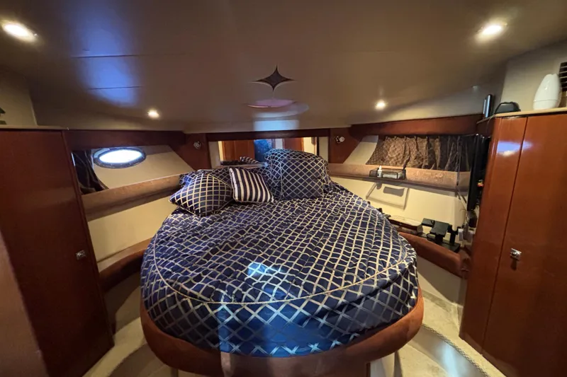 Slide: The Image of Luxurious cabin interior of 2007 Meridian 391 Sedan yacht with elegant bedding. - 4