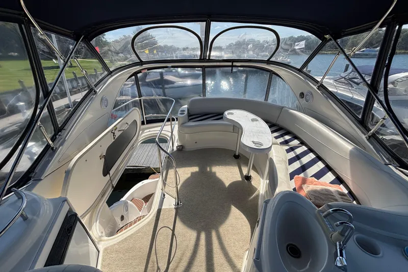 Slide: The Image of 2007 Meridian 391 Sedan interior with seating, table, and water view. - 9