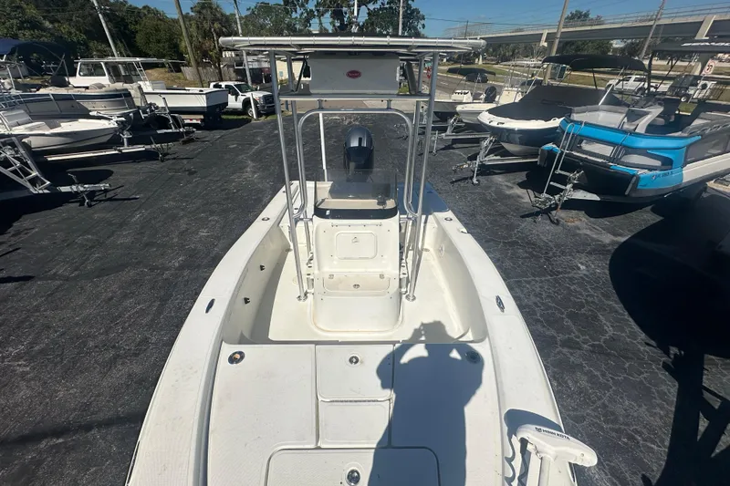 Slide: The Image of 2003 Hydra-Sports 19 Bay Bolt boat, white deck, parked among other boats. - 13