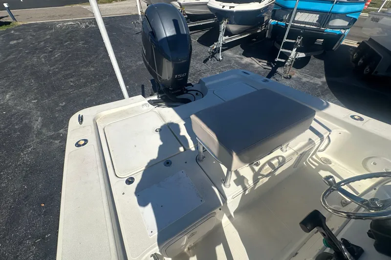 Slide: The Image of 2003 Hydra-Sports 19 Bay Bolt boat interior with seating and outboard motor. - 17