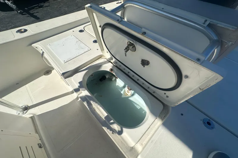 Slide: The Image of Open storage compartment on 2003 Hydra-Sports 19 Bay Bolt boat deck. - 19