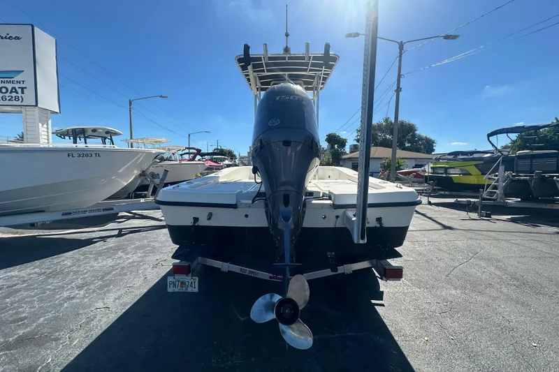 Slide: The Image of 2003 Hydra-Sports 19 Bay Bolt boat with outboard motor, parked on a trailer. - 4