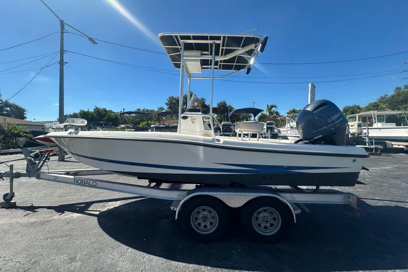 Slide: The Image of 2003 Hydra-Sports 19 Bay Bolt boat on trailer, parked outdoors under clear blue sky. - 7
