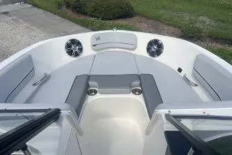 Slide: The Image of 2023 Bayliner VR5 Bowrider OB interior with seating and speakers. - 12