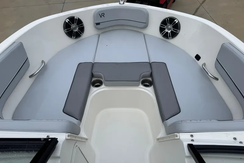 Slide: The Image of 2023 Bayliner VR5 Bowrider OB interior with gray seating and cup holders. - 13