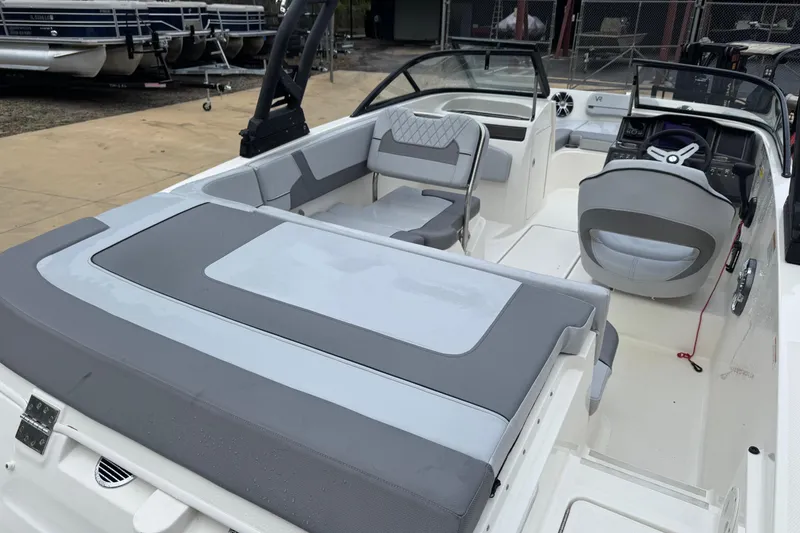 Slide: The Image of 2023 Bayliner VR5 Bowrider OB interior with gray seating and modern dashboard. - 17