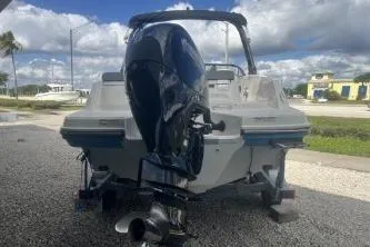 Slide: The Image of 2023 Bayliner VR5 Bowrider OB displayed on a trailer at a dealership. - 5