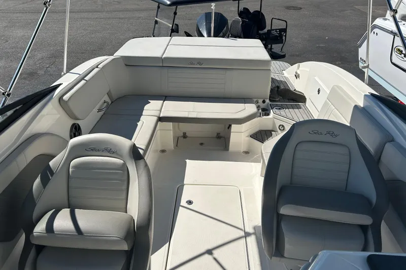 Slide: The Image of 2020 Sea Ray SPX 230 Outboard boat interior with spacious seating and elegant design. - 10
