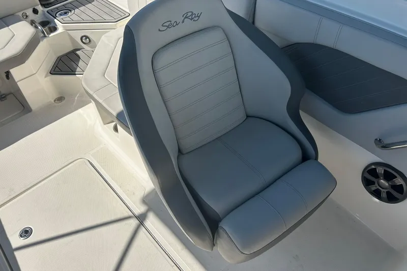 Slide: The Image of 2020 Sea Ray SPX 230 Outboard boat interior with gray seating and cup holders. - 13