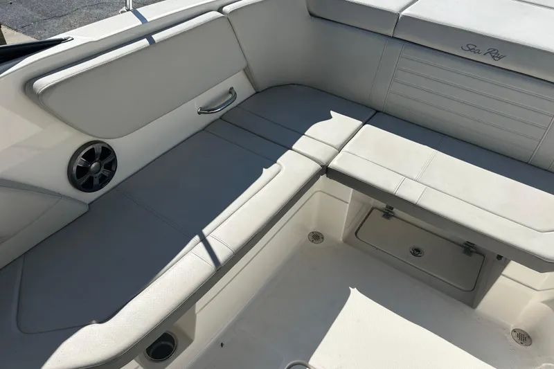 Slide: The Image of 2020 Sea Ray SPX 230 Outboard boat interior with cushioned seating and speaker. - 15