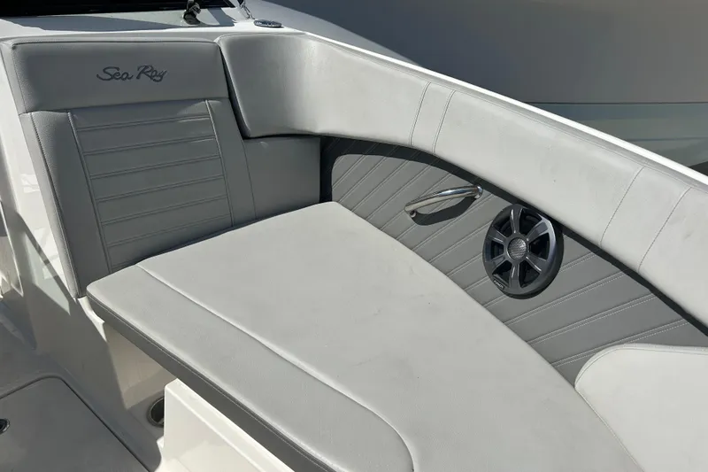 Slide: The Image of 2020 Sea Ray SPX 230 Outboard boat interior with gray seating and speaker. - 9