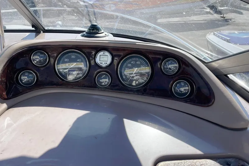 Slide: The Image of Dashboard of 2004 Regal Commodore 2665 boat with gauges and controls. - 24