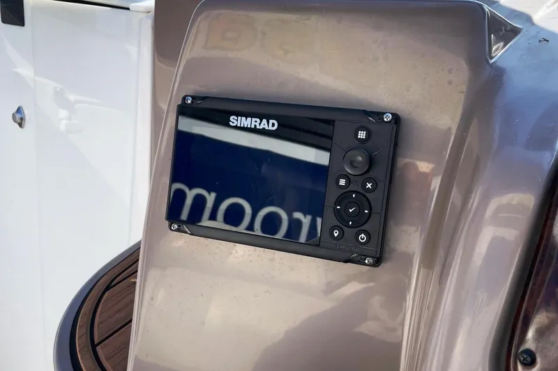 Slide: The Image of Simrad navigation system on 2004 Regal Commodore 2665 boat dashboard. - 26