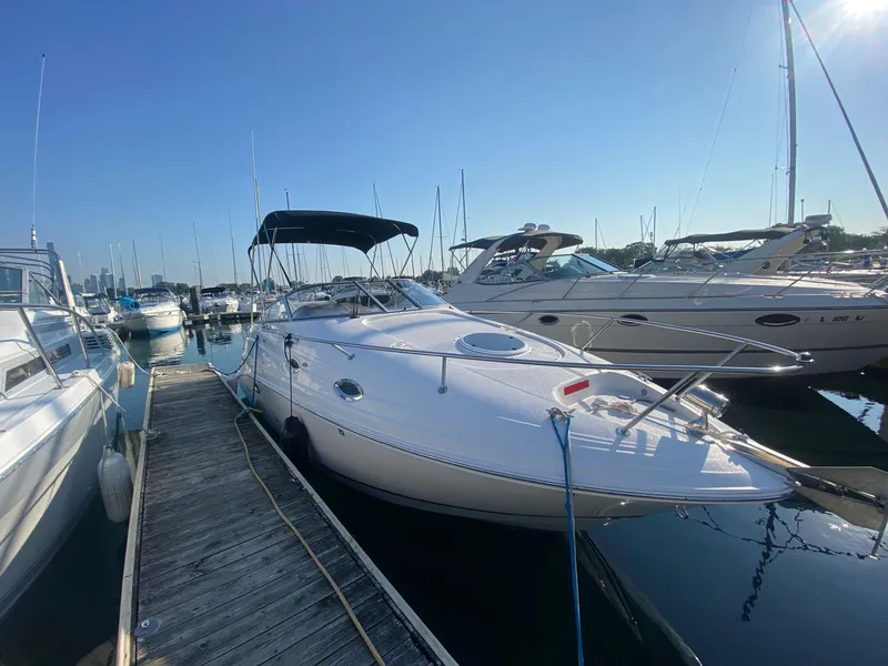 Slide: The Image of 2004 Regal 2665 Commodore boat docked at marina on a sunny day. - 3