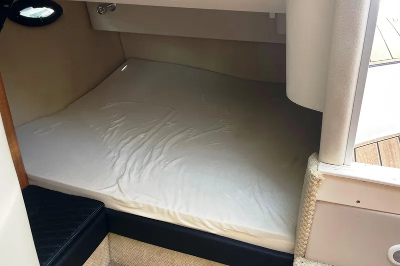 Slide: The Image of 2004 Regal Commodore 2665 cabin interior with a cozy sleeping area. - 35