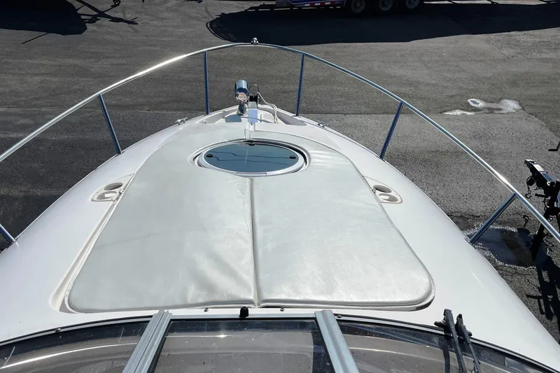 Slide: The Image of 2004 Regal Commodore 2665 boat deck with sunpad and railing, viewed from above. - 4