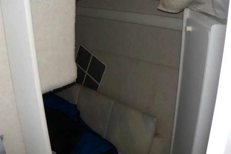 Slide: The Image of Interior cabin of 1994 Bayliner 2859 Classic Cruiser with seating and storage. - 13