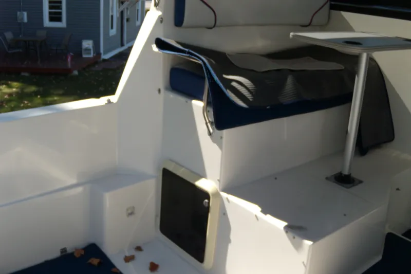 Slide: The Image of 1994 Bayliner 2859 Classic Cruiser interior with seating and table, showcasing clean design. - 19