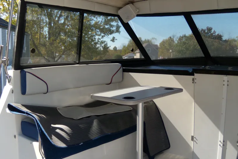 Slide: The Image of Interior of 1994 Bayliner 2859 Classic Cruiser with seating and table. - 6
