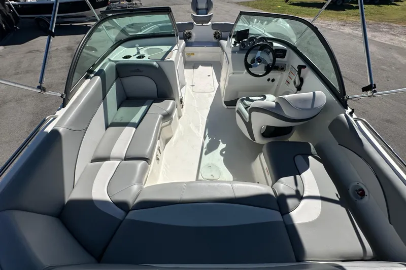 Slide: The Image of 2021 NauticStar 203 DC boat interior with spacious seating and modern dashboard. - 20