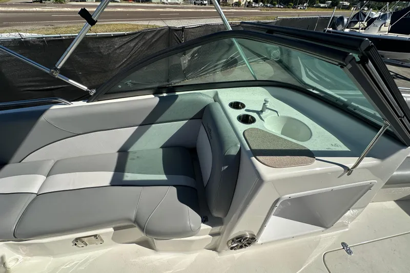 Slide: The Image of 2021 NauticStar 203 DC boat interior with seating and sink area. - 26