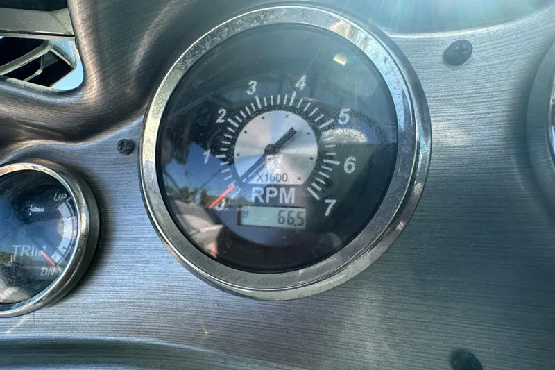 Slide: The Image of Close-up of 2021 NauticStar 203 DC boat RPM gauge showing 665 RPM. - 32