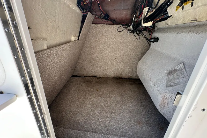 Slide: The Image of Interior view of 2021 NauticStar 203 DC boat storage compartment. - 44