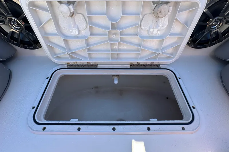 Slide: The Image of Open storage compartment on 2021 NauticStar 203 DC boat deck. - 54