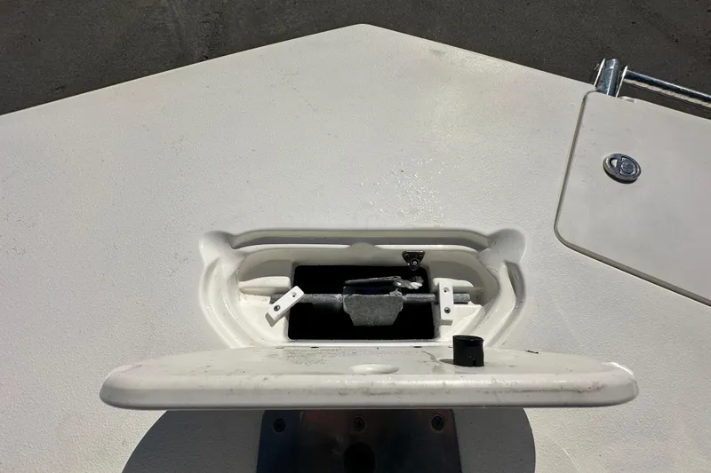 Slide: The Image of 2021 NauticStar 203 DC boat anchor compartment with open hatch, showcasing storage area. - 58