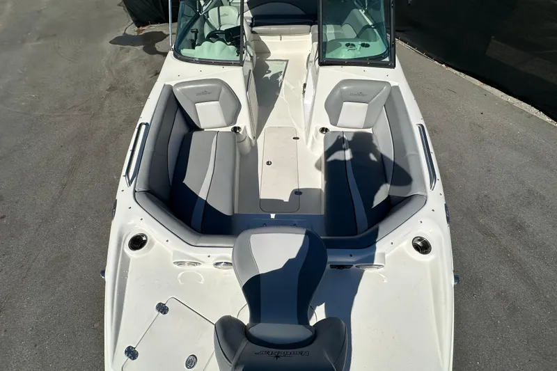 Slide: The Image of 2021 NauticStar 203 DC boat interior with gray seating and open deck layout. - 61