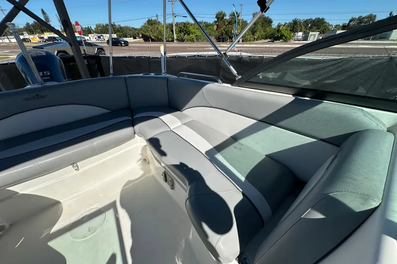 Slide: The Image of 2021 NauticStar 203 DC boat interior with gray seating and open deck view. - 73