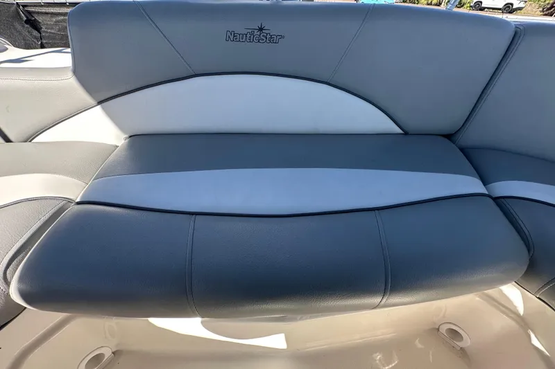 Slide: The Image of 2021 NauticStar 203 DC boat seat with gray and white upholstery. - 82