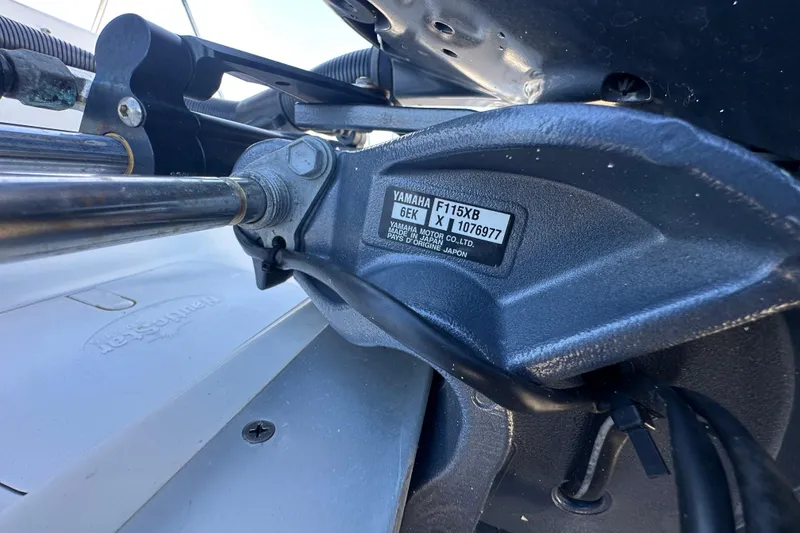 Slide: The Image of Close-up of Yamaha F115XB engine on 2021 NauticStar 203 DC boat. - 90