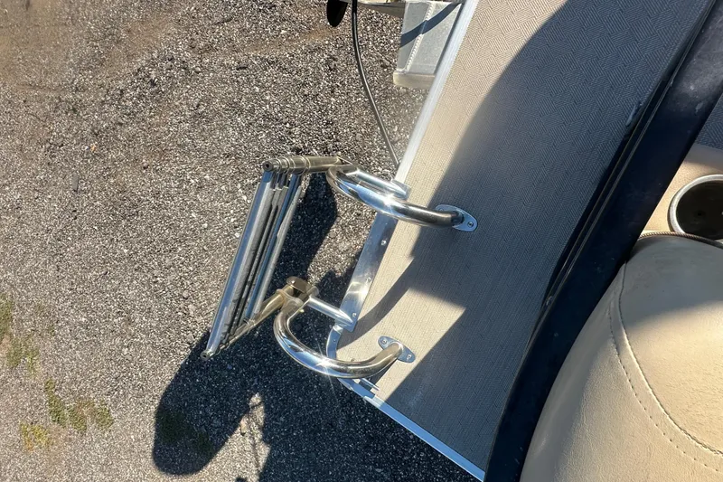 Slide: The Image of Boat ladder on a 2020 Godfrey SWEETWATER 2186 SB, resting on textured surface. - 13