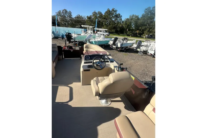 Slide: The Image of 2020 Godfrey SWEETWATER 2186 SB pontoon boat interior with captain's chair and steering console. - 15