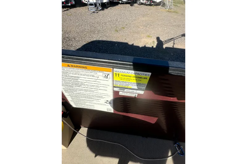 Slide: The Image of Warning label on 2020 Godfrey SWEETWATER 2186 SB, maximum capacity 11 persons or 1540 lbs. - 18