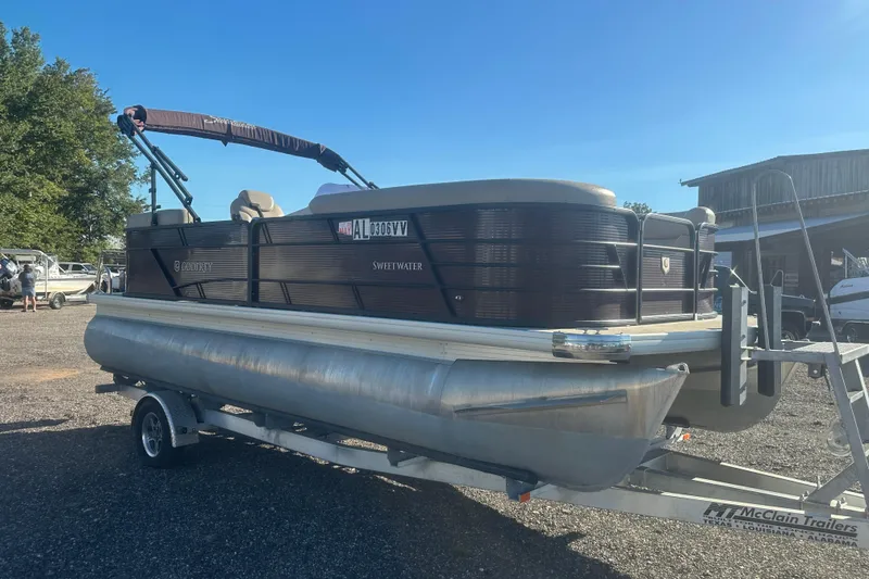 Slide: The Image of 2020 Godfrey SWEETWATER 2186 SB pontoon boat on trailer, parked outdoors. - 5