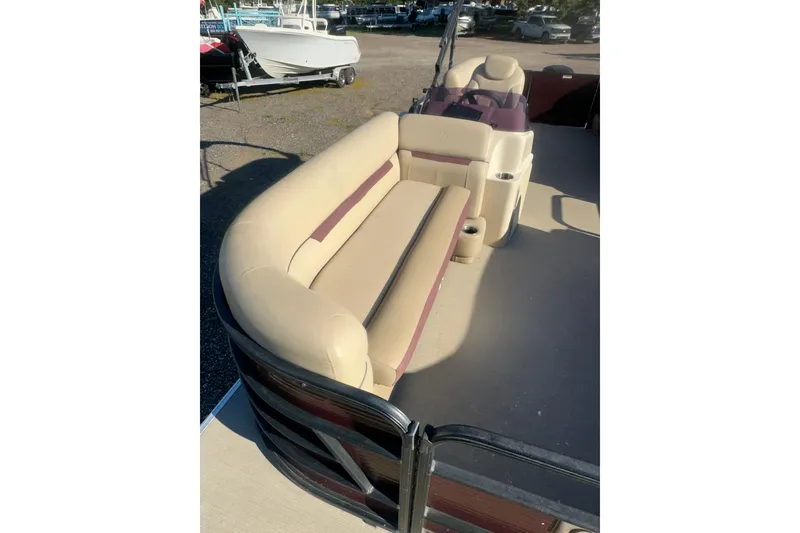 Slide: The Image of 2020 Godfrey SWEETWATER 2186 SB pontoon boat with beige seating and cup holders. - 7