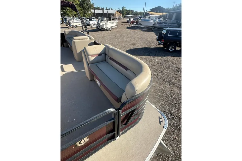 Slide: The Image of 2020 Godfrey SWEETWATER 2186 SB pontoon boat with beige seating, parked outdoors. - 8