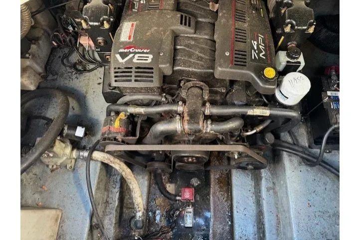 Slide: The Image of Engine compartment of a 1999 Sea Ray 260 Sundancer with MerCruiser V8 engine. - 14