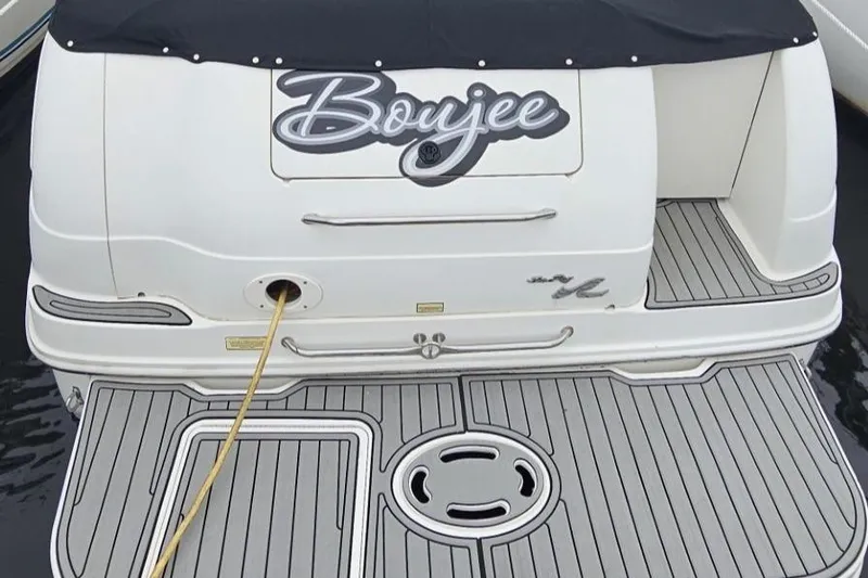 Slide: The Image of 1999 Sea Ray 260 Sundancer boat with custom "Boujee" decal on the stern. - 4