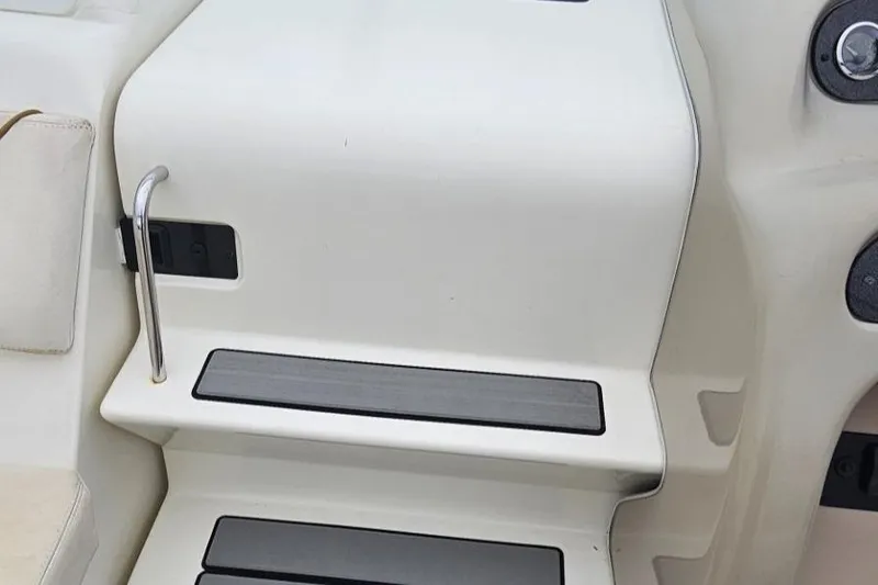 Slide: The Image of Steps and railing on a 1999 Sea Ray 260 Sundancer boat interior. - 6