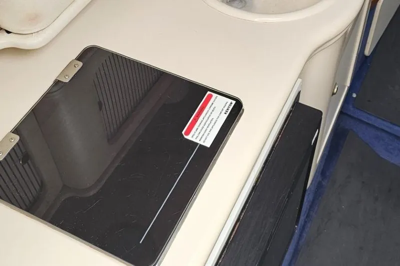 Slide: The Image of 1999 Sea Ray 260 Sundancer interior with countertop and sink detail. - 9