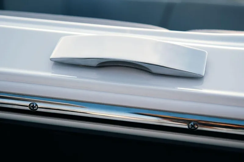 Slide: The Image of Close-up of 2026 Four Winns H9 OB boat handle and chrome detailing. - 4
