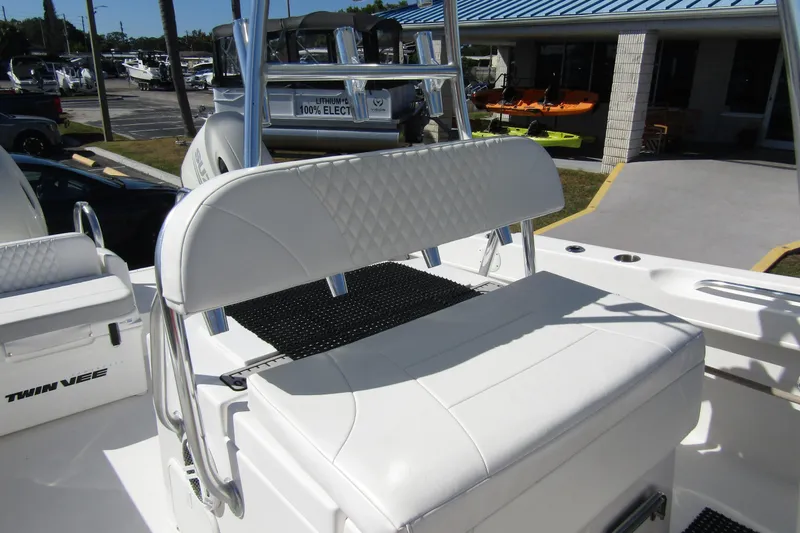 Slide: The Image of 2021 Twin Vee 260 CC GF boat interior with white seating and stainless steel accents. - 19