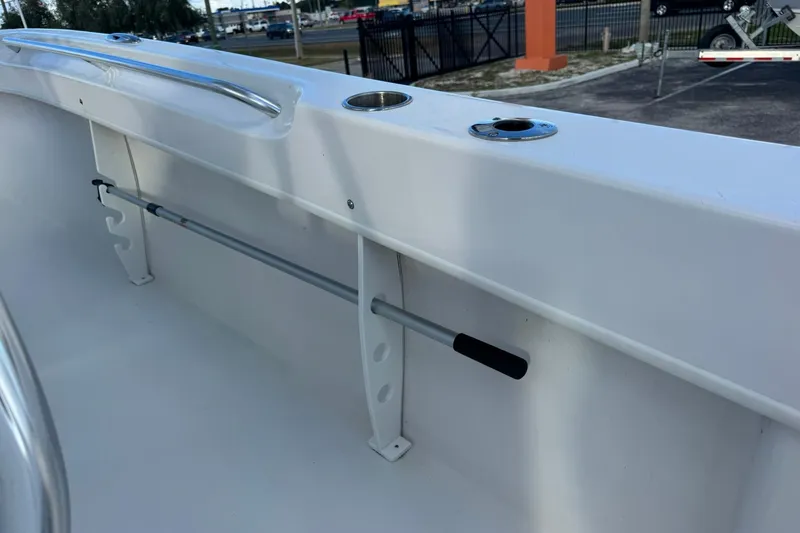 Slide: The Image of 2021 Twin Vee 260 CC GF boat interior with rod holder and stainless steel railing. - 23