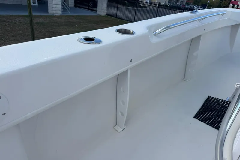 Slide: The Image of 2021 Twin Vee 260 CC GF boat interior with rod holders and railing. - 24