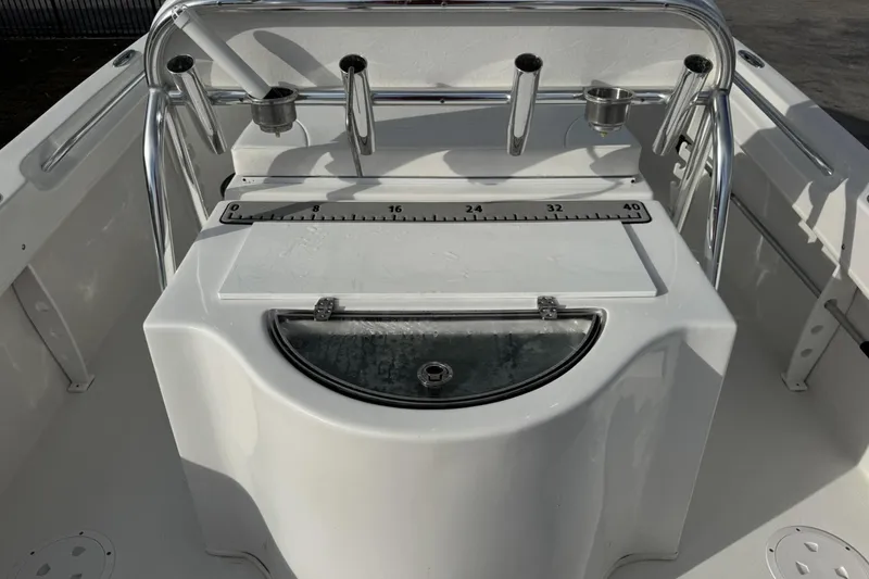Slide: The Image of 2021 Twin Vee 260 CC GF boat console with rod holders and measurement scale. - 28